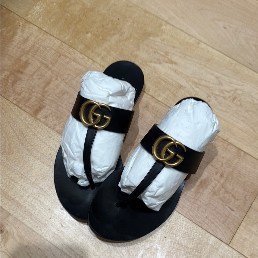 Gucci Black Slides with Gold Emblem